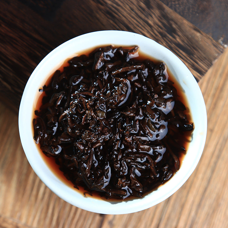 Yunnan Pu-erh tea leaves Yiwu Golden Bud 357g Seven Sons Cake Ripe Tea Black tea Cake Ripe Tea Golden Bud Ancient Tree Material